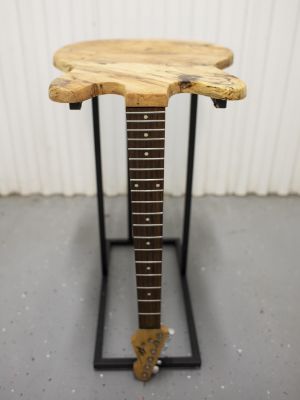 Guitar shaped side table by The Outer Ring